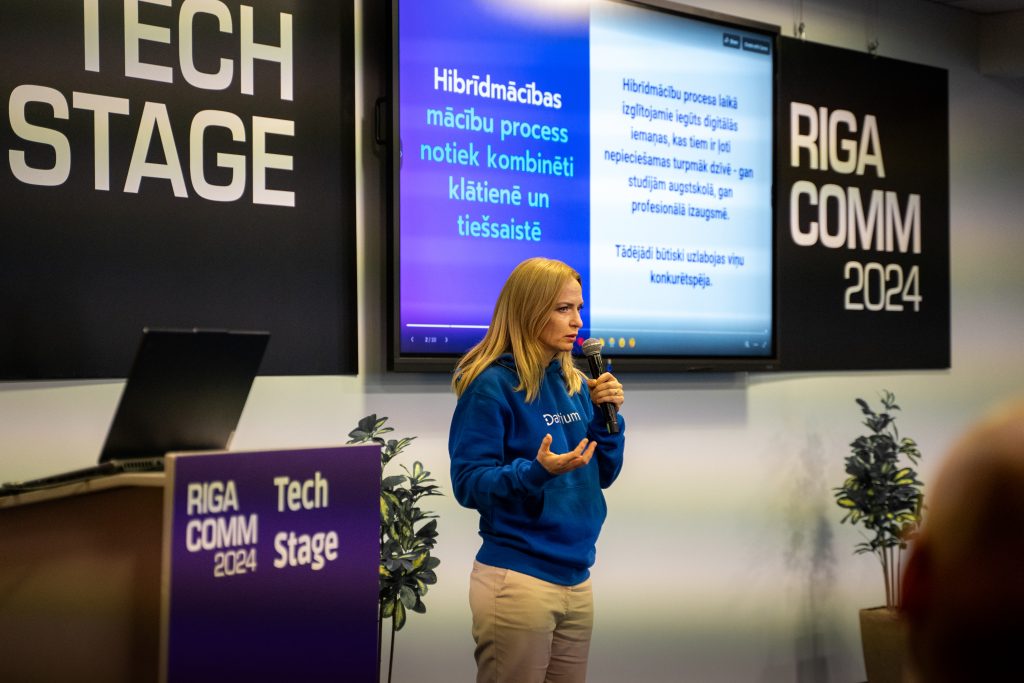 A speaker presenting at the EdTech conference during RIGA COMM 2024