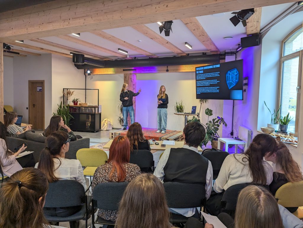 Girls listening to a talk at the PyGirls closing event